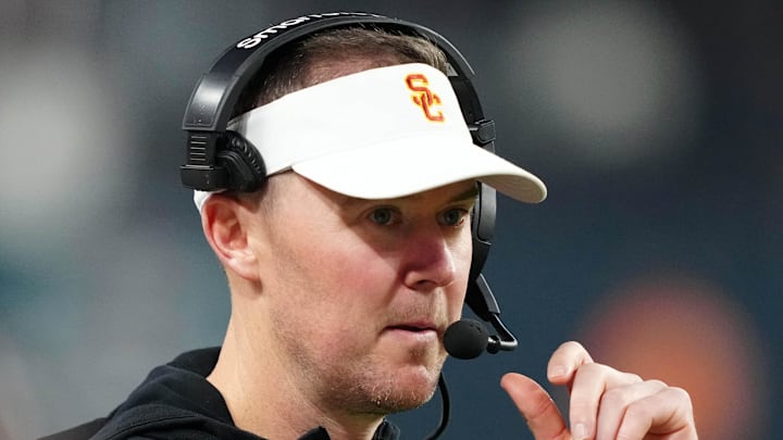 Dec 27, 2024; Las Vegas, NV, USA; Southern California Trojans head coach Lincoln Riley reacts against the Texas A&M Aggies in the second half at Allegiant Stadium. Mandatory Credit: Kirby Lee-Imagn Images