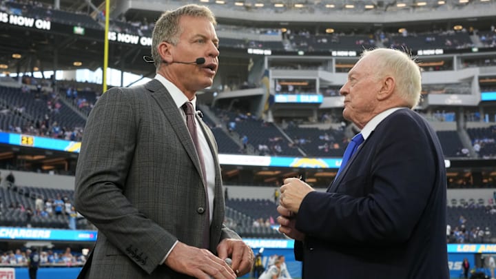 Dallas Cowboys owner Jerry Jones talks with former quarterback Troy Aikman before the game against the Los Angeles Chargers.