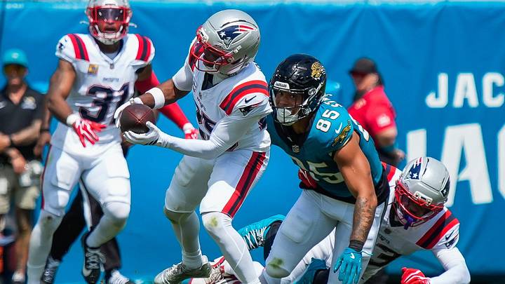 New England Patriots cornerback Marcus Jones (25) intercepts a pass intended for Jacksonville Jaguars tight end Brenton Strange (85)  in the first quarter during an NFL football game at EverBank Stadium, Sunday, September 27, 2026, in Jacksonville, Fla. [Doug Engle/Florida Times-Union]