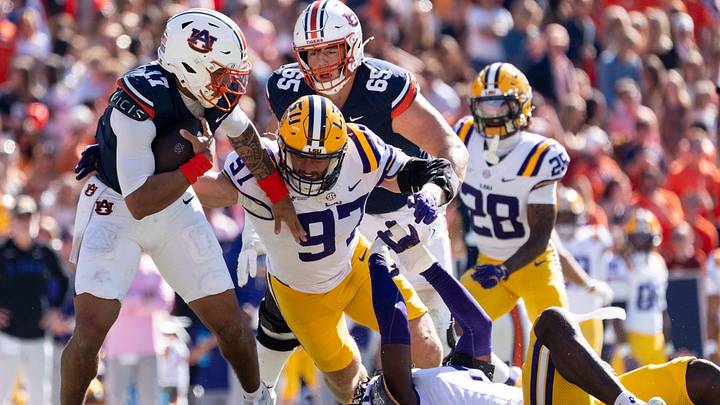 Auburn Tigers quarterback Byrum Brown (17) is sacked by LSU Tigers defensive end Dylan Carpenter (97) as Auburn Tigers take on LSU Tigers at Jordan-Hare Stadium in Auburn, Ala. on Saturday, Oct. 24, 2026. LSU Tigers defeated Auburn Tigers 38-17.