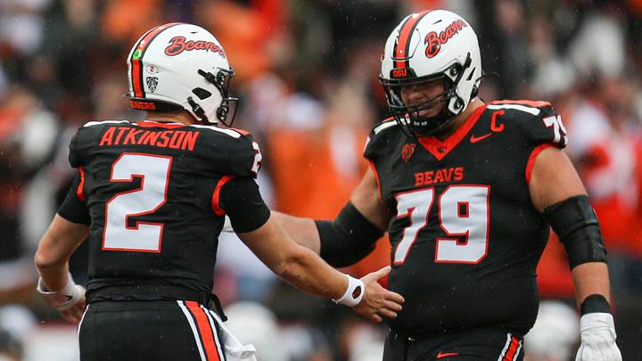 Oregon State's Braden Atkinson, left, celebrates with his teammate Tyler Voltin after throwing a touchdown during an NCAA football game at Reser Stadium on Saturday, Sept. 12, 2026, in Corvallis, Oregon