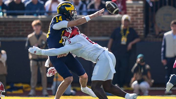 Indiana linebacker Rolijah Hardy (5) forces Michigan quarterback Tommy Carr (14) to fumble during the first half at Michigan Stadium in Ann Arbor on Saturday, Oct. 24, 2026. Indiana linebacker Rolijah Hardy (5) forces Michigan quarterback Tommy Carr (14) to fumble during the first half at Michigan Stadium in Ann Arbor on Saturday, Oct. 24, 2026.