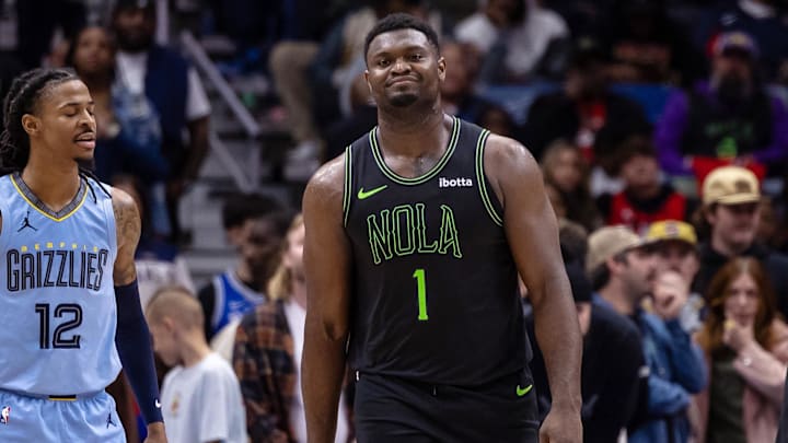 Dec 26, 2023; New Orleans, Louisiana, USA; New Orleans Pelicans forward Zion Williamson (1) reacts to a charging foul against Memphis Grizzlies guard Marcus Smart (36) during overtime at Smoothie King Center. Mandatory Credit: Stephen Lew-Imagn Images