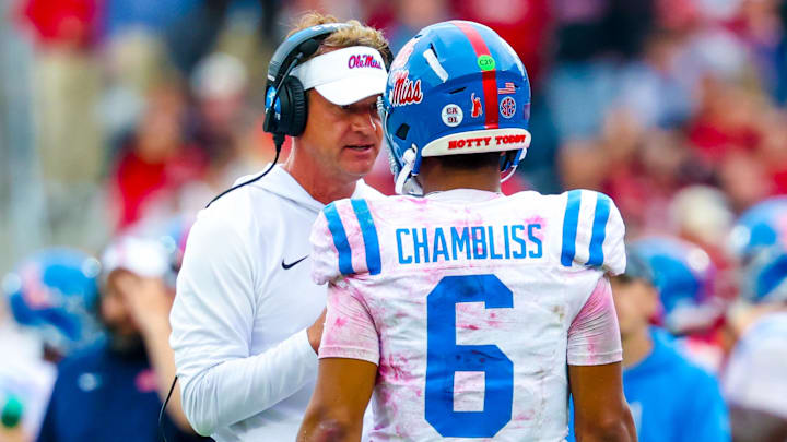 Oct 25, 2025; Norman, Oklahoma, USA;  Ole Miss Rebels head coach Lane Kiffin speaks with Ole Miss Rebels quarterback Trinidad Chambliss (6) during the second half at Gaylord Family-Oklahoma Memorial Stadium. Mandatory Credit: Kevin Jairaj-Imagn Images