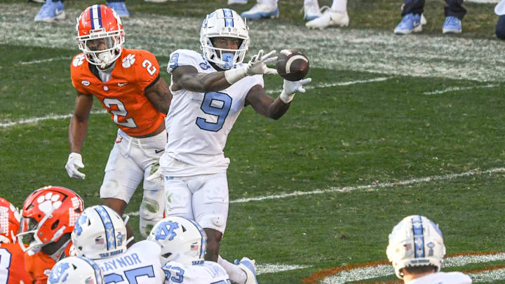 Nov 18, 2023; Clemson, South Carolina, USA; North Carolina Tar Heels wide receiver Devontez Walker (9) catches a ball near Clemson Tigers cornerback Nate Wiggins (2) Ruinard-USA TODAY Sports