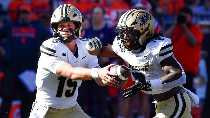 Oct 3, 2026; Champaign, Illinois, USA; Purdue Boilermakers quarterback Ryan Browne (15) hands the ball to running back Fame Ijeboi (2) during the first half at Gies Memorial Stadium. Mandatory Credit: Ron Johnson-Imagn Images Oct 3, 2026; Champaign, Illinois, USA; Purdue Boilermakers quarterback Ryan Browne (15) hands the ball to running back Fame Ijeboi (2) during the first half at Gies Memorial Stadium. Mandatory Credit: Ron Johnson-Imagn Images
