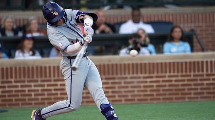 LSU Tigers' Daniel Dickinson (14) swings at the ball as Auburn Tigers take on LSU Tigers at Plainsman Park in Auburn, Ala., on Saturday, April 12, 2025.