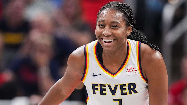 Indiana Fever forward Aliyah Boston (7) smiles after scoring Friday, July 12, 2024, during the game at Gainbridge Fieldhouse in Indianapolis. The Indiana Fever defeated the Phoenix Mercury, 95-86. Indiana Fever forward Aliyah Boston (7) smiles after scoring Friday, July 12, 2024, during the game at Gainbridge Fieldhouse in Indianapolis. The Indiana Fever defeated the Phoenix Mercury, 95-86.