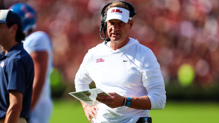 Oct 5, 2024; Columbia, South Carolina, USA; Mississippi Rebels head coach Lane Kiffin directs his team against the South Carolina Gamecocks in the first quarter at Williams-Brice Stadium. Mandatory Credit: Jeff Blake-Imagn Images Oct 5, 2024; Columbia, South Carolina, USA; Mississippi Rebels head coach Lane Kiffin directs his team against the South Carolina Gamecocks in the first quarter at Williams-Brice Stadium. Mandatory Credit: Jeff Blake-Imagn Images