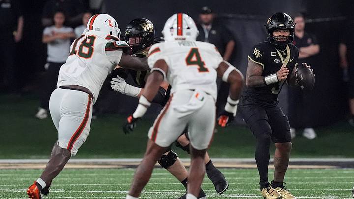 Sep 18, 2026; Winston-Salem, North Carolina, USA; Wake Forest Demon Deacons quarterback Gio Lopez (3) looks to pass pressured by Miami (FL) Hurricanes defensive lineman Armondo Blount (18) and linebacker Cameron Pruitt (4) during the second half at Allegacy Federal Credit Union Stadium. Mandatory Credit: Jim Dedmon-Imagn Images Sep 18, 2026; Winston-Salem, North Carolina, USA; Wake Forest Demon Deacons quarterback Gio Lopez (3) looks to pass pressured by Miami (FL) Hurricanes defensive lineman Armondo Blount (18) and linebacker Cameron Pruitt (4) during the second half at Allegacy Federal Credit Union Stadium. Mandatory Credit: Jim Dedmon-Imagn Images