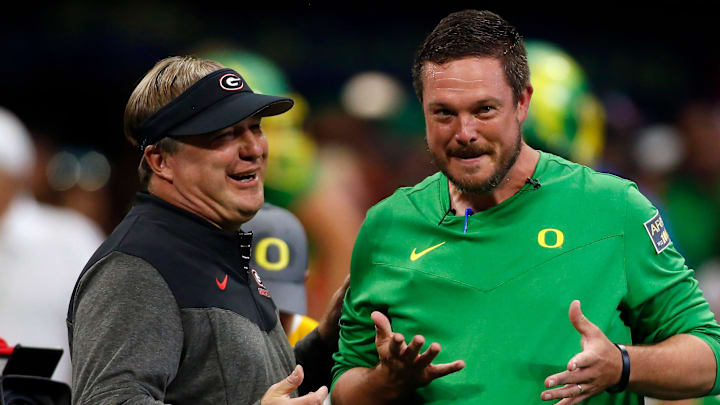 Georgia head coach Kirby Smart and Oregon head coach Dan Lanning meet during warm ups before the start of the Chick-fil-A Kickoff NCAA college football game between Oregon and Georgia in Atlanta, on Saturday, Sept. 3, 2022.