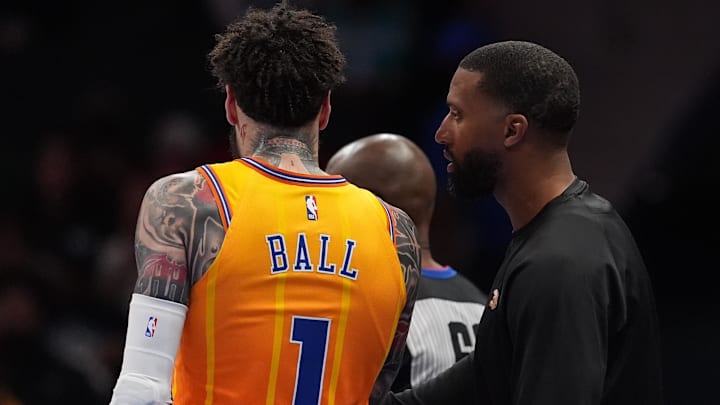 Apr 10, 2026; Charlotte, North Carolina, USA; Charlotte Hornets Head Coach Charles Lee talks with guard LaMelo Ball (1) during a time out during first quarter against the Detroit Pistons at Spectrum Center. Mandatory Credit: Jim Dedmon-Imagn Images
