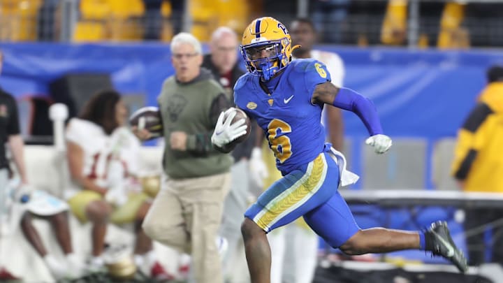 Nov 16, 2023; Pittsburgh, Pennsylvania, USA;  Pittsburgh Panthers running back Rodney Hammond Jr. (6) scores on a sixty-five yard touchdown run against the Boston College Eagles during the fourth quarter at Acrisure Stadium. Mandatory Credit: Charles LeClaire-Imagn Images