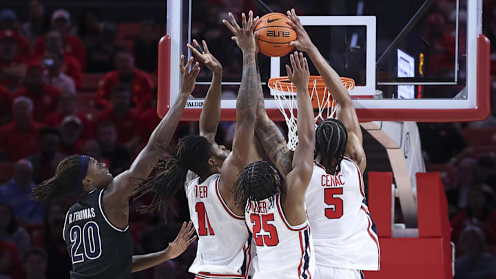Dec 10, 2025; Houston, Texas, USA; Houston Cougars forward Joseph Tugler (11) and guard Mercy Miller (25) and forward Chris Cenac Jr. (5) attempt to get a rebound away from Jackson State Tigers forward Raevon Thomas (20) during the first half at Fertitta Center. Mandatory Credit: Troy Taormina-Imagn Images Dec 10, 2025; Houston, Texas, USA; Houston Cougars forward Joseph Tugler (11) and guard Mercy Miller (25) and forward Chris Cenac Jr. (5) attempt to get a rebound away from Jackson State Tigers forward Raevon Thomas (20) during the first half at Fertitta Center. Mandatory Credit: Troy Taormina-Imagn Images