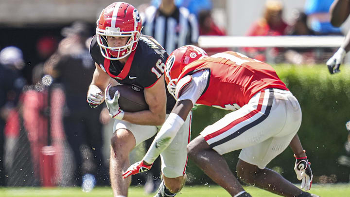 Apr 12, 2025; Athens, GA, USA; Georgia Bulldogs wide receiver London Humphreys (16) runs against defensive back Adrian Maddox (14) during the Georgia Spring game at Sanford Stadium. Mandatory Credit: Dale Zanine-Imagn Images