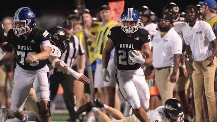 Washburn Rural runs the ball against Topeka High during the game at Washburn Rural High School on Oct. 3, 2025.