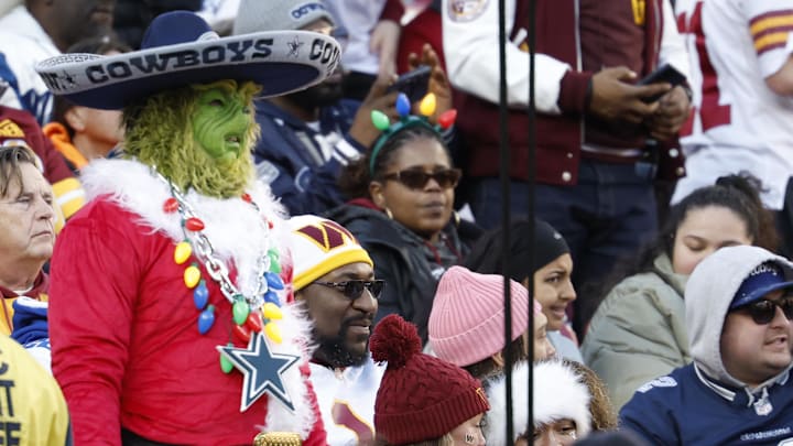 A Dallas Cowboys fan looks on from he stands against the Washington Commanders at Northwest Stadium. 