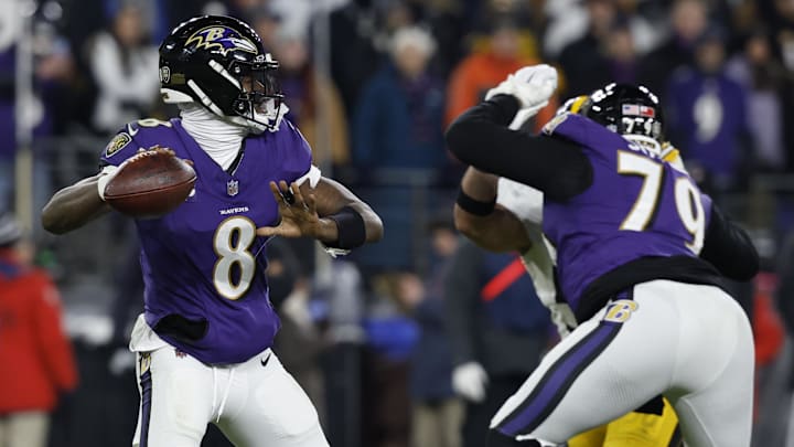Jan 11, 2025; Baltimore, Maryland, USA; Baltimore Ravens quarterback Lamar Jackson (8) passes the ball against the Pittsburgh Steelers in an AFC wild card game at M&T Bank Stadium. Mandatory Credit: Geoff Burke-Imagn Images