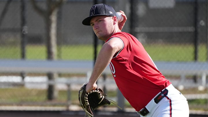 Feb 15, 2025; West Palm Beach, FL, USA; Washington Nationals pitcher Brad Lord (61) takes infield practice during Spring Training. 