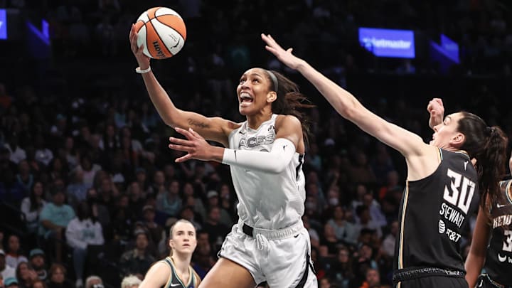 Oct 1, 2024; Brooklyn, New York, USA; Las Vegas Aces center A'ja Wilson (22) and New York Liberty forward Breanna Stewart (30) during game two of the 2024 WNBA Semi-finals at Barclays Center. Mandatory Credit: Wendell Cruz-Imagn Images