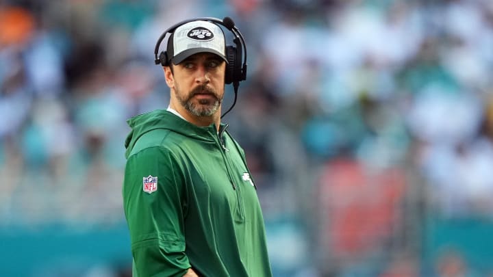 Dec 17, 2023; Miami Gardens, Florida, USA; New York Jets quarterback Aaron Rodgers (8) walks onto the field during an injury timeout in the first half against the Miami Dolphins at Hard Rock Stadium. Mandatory Credit: Jasen Vinlove-USA TODAY Sports