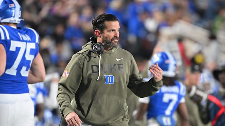 Nov 15, 2025; Durham, North Carolina, USA;  Duke Blue Devils head coach Manny Diaz reacts during the third quarter against the Virginia Cavaliers at Wallace Wade Stadium. Mandatory Credit: Zachary Taft-Imagn Images