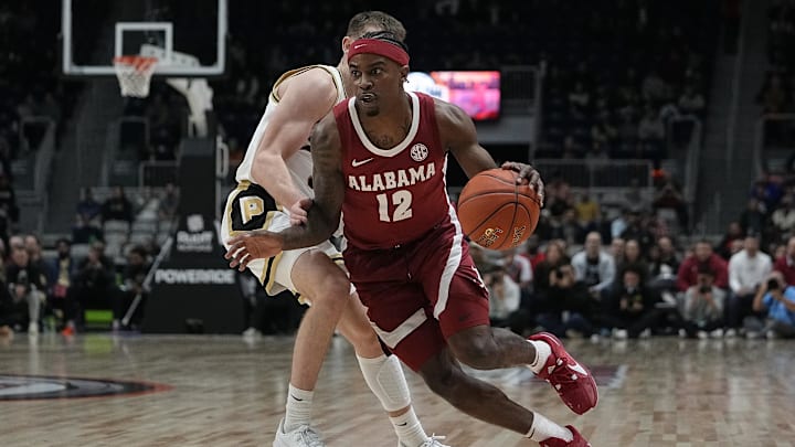 Dec 9, 2023; Toronto, Ontario, CAN; Alabama Crimson Tide guard Latrell Wrightsell Jr. (12) drives to the basket against the Purdue Boilermakers during the first half at Coca-Cola Coliseum. Mandatory Credit: John E. Sokolowski-USA TODAY Sports