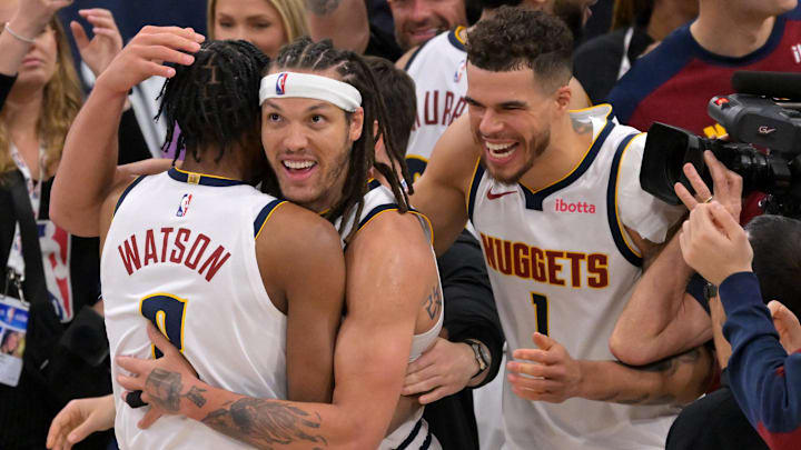 Apr 26, 2025; Inglewood, California, USA; Denver Nuggets forward Aaron Gordon (32) is congratulated by forward Peyton Watson (8) and forward Michael Porter Jr. (1) after the game winning dunk to defeat the Los Angeles Clippers 101-99 in game four of round one of the 2024 NBA Playoffs at Intuit Dome. Mandatory Credit: Jayne Kamin-Oncea-Imagn Images