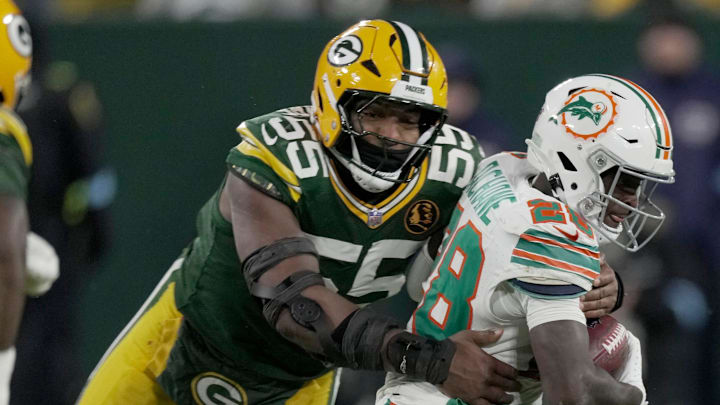 Green Bay Packers defensive end Kingsley Enagbare (55) tackles Miami Dolphins running back De'Von Achane on Thursday. Green Bay Packers defensive end Kingsley Enagbare (55) tackles Miami Dolphins running back De'Von Achane on Thursday.
