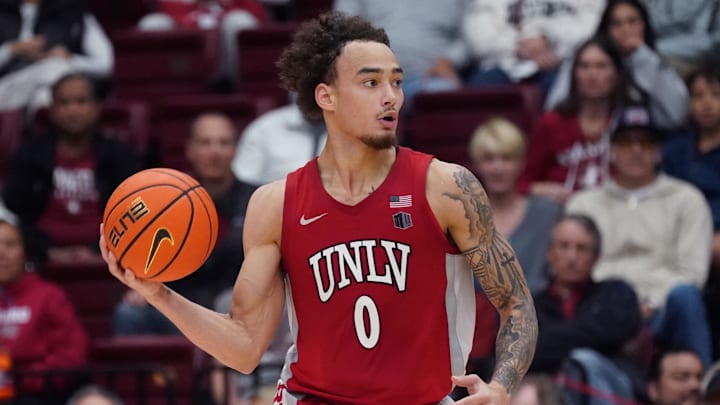 UNLV Runnin' Rebels guard Dra Gibbs-Lawhorn (0) dribbles upcourt against the Stanford Cardinal in the second half at Maples Pavilion. Mandatory Credit: David Gonzales-Imagn Images