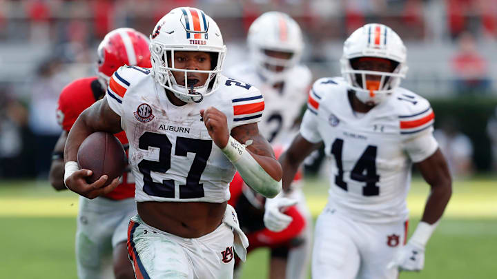 Auburn running back Jarquez Hunter (27) drives in for a touchdown during the second half of a NCAA college football game against Georgia in Athens, Ga., on Saturday, Oct. 5, 2024.