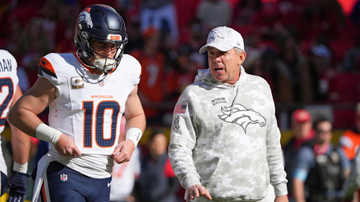 Nov 10, 2024; Kansas City, Missouri, USA; Denver Broncos quarterback Bo Nix (10) talks with head coach Sean Payton against the Kansas City Chiefs prior to a game at GEHA Field at Arrowhead Stadium. 