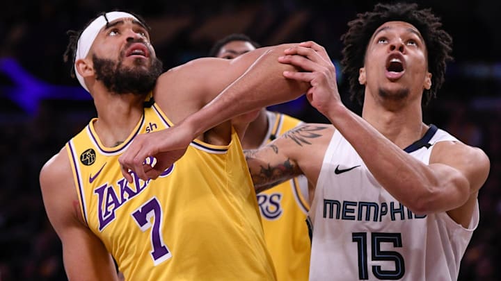 Feb 21, 2020; Los Angeles, California, USA;  Los Angeles Lakers center JaVale McGee (7) and Memphis Grizzlies forward Brandon Clarke (15) battle for rebounding position during the fourth quarter at Staples Center. Mandatory Credit: Robert Hanashiro-Imagn Images