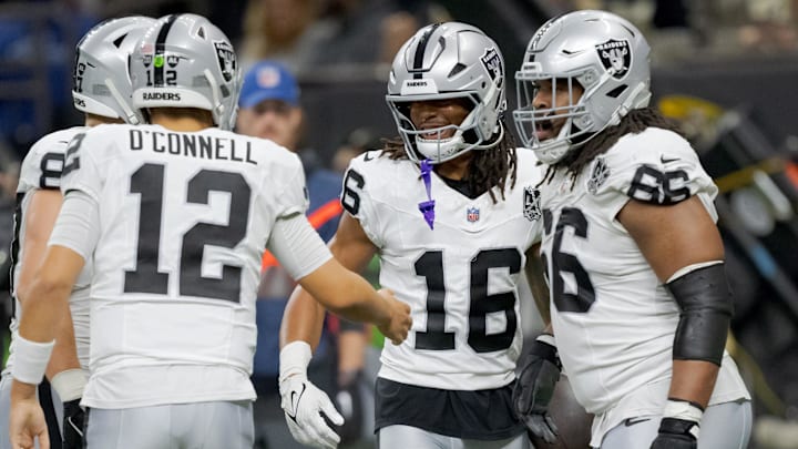 Dec 29, 2024; New Orleans, Louisiana, USA; Las Vegas Raiders wide receiver Jakobi Meyers (16) celebrates a touchdown reception throw by Las Vegas Raiders quarterback Aidan O'Connell (12) during the second quarter against the New Orleans Saints at Caesars Superdome. Mandatory Credit: Matthew Hinton-Imagn Images