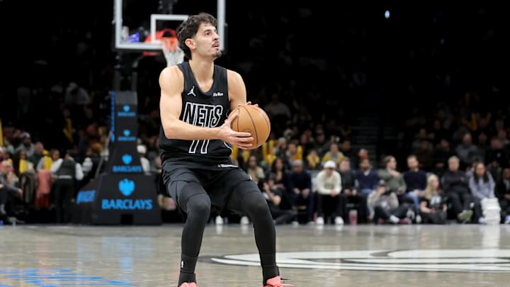 Feb 7, 2026; Brooklyn, New York, USA; Brooklyn Nets guard Ben Saraf (77) shoots a three point shot against the Washington Wizards during the fourth quarter at Barclays Center. Mandatory Credit: Brad Penner-Imagn Images