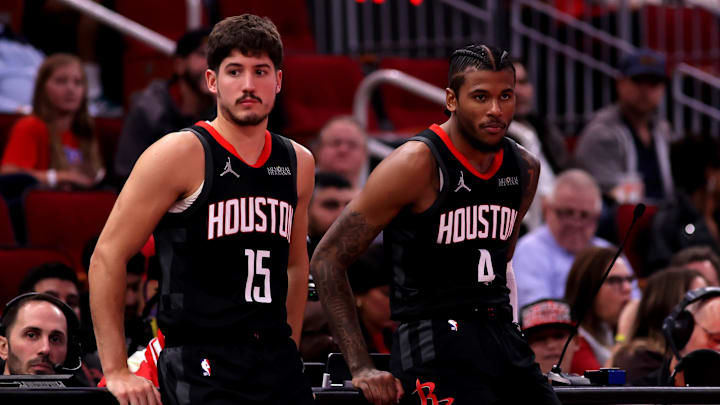 Nov 22, 2024; Houston, Texas, USA; Houston Rockets guards Reed Sheppard (15) and Jalen Green (4) at the scorer's table during the game against the Portland Trailblazers at Toyota Center. Mandatory Credit: Erik Williams-Imagn Images