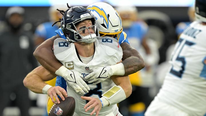 Nov 10, 2024; Inglewood, California, USA;  Tennessee Titans quarterback Will Levis (8) is sacked by Los Angeles Chargers linebacker Bud Dupree (48) in the second half at SoFi Stadium. Mandatory Credit: Jayne Kamin-Oncea-Imagn Images