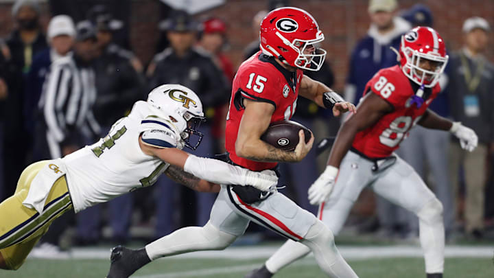 Georgia quarterback Carson Beck (15) runs the ball during the second half of a NCAA college football game against Georgia Tech in Atlanta, on Saturday, Nov. 25, 2023.Georgia won 31-23.
