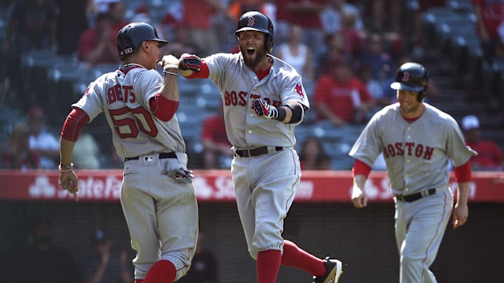 Jul 31, 2016; Anaheim, CA, USA; Boston Red Sox second baseman Dustin Pedroia (center) celebrates with right fielder Mookie Betts (left) after hitting a three-run home run against the Los Angeles Angels during the ninth inning at Angel Stadium of Anaheim. Mandatory Credit: Kelvin Kuo-Imagn Images Jul 31, 2016; Anaheim, CA, USA; Boston Red Sox second baseman Dustin Pedroia (center) celebrates with right fielder Mookie Betts (left) after hitting a three-run home run against the Los Angeles Angels during the ninth inning at Angel Stadium of Anaheim. Mandatory Credit: Kelvin Kuo-Imagn Images