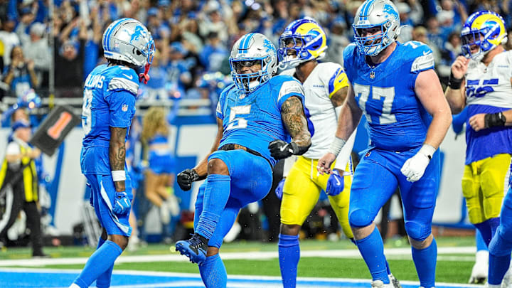 Detroit Lions running back David Montgomery celebrates scoring the winning 1-yard touchdown against the Los Angeles Rams during overtime for a 26-20 victory in the season opener at Ford Field in Detroit on Sunday, Sept. 8, 2024.