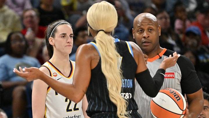  Indiana Fever guard Caitlin Clark (22) looks to pass the ball in bounds against Chicago Sky guard DiJonai Carrington (7).
