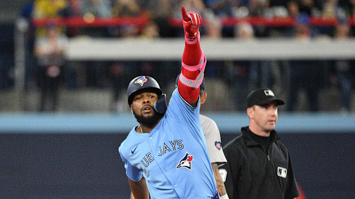 Sep 24, 2024; Toronto, Ontario, CAN; Toronto Blue Jays designated hitter Vladimir Guerrero Jr. (27) reacts after hitting a two run RBI double against the Boston Red Sox in the third inning at Rogers Centre. Mandatory Credit: Dan Hamilton-Imagn Images