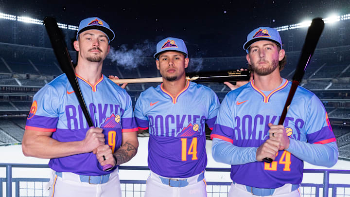 Outfielder Brenton Doyle, shortstop Ezequiel Tovar and third baseman Ryan McMahon pose in the Colorado Rockies' new City Connect uniforms.
