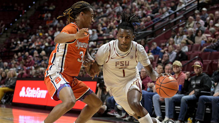 Jan 4, 2025; Tallahassee, Florida, USA; Florida State Seminoles forward Jamir Watkins (1) drives the ball to the net against Syracuse Orange guard Lucas Taylor (3) during the first half at Donald L. Tucker Center. Mandatory Credit: Melina Myers-Imagn Images Jan 4, 2025; Tallahassee, Florida, USA; Florida State Seminoles forward Jamir Watkins (1) drives the ball to the net against Syracuse Orange guard Lucas Taylor (3) during the first half at Donald L. Tucker Center. Mandatory Credit: Melina Myers-Imagn Images