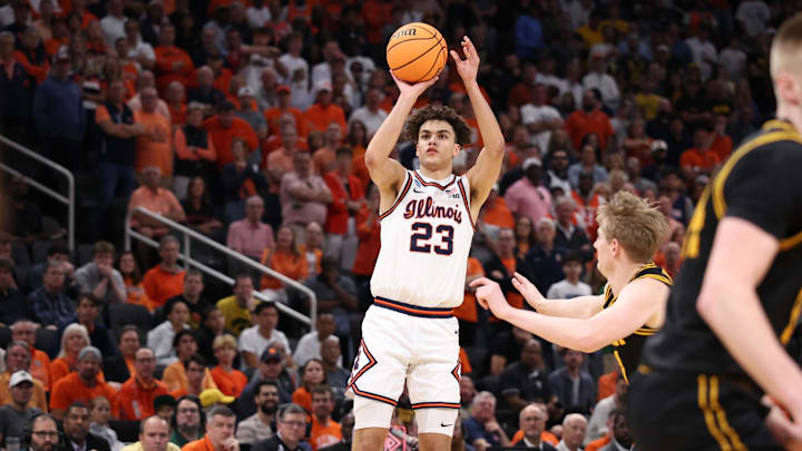 Illinois' guard Keaton Wagler (23) shoots against the Iowa Hawkeyes. Illinois' guard Keaton Wagler (23) shoots against the Iowa Hawkeyes.