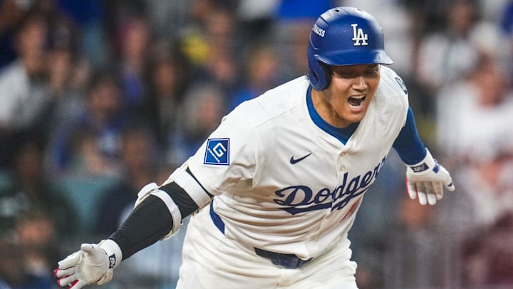 Los Angeles Dodgers designated hitter Shohei Ohtani celebrates as he runs for first on an RBI single.