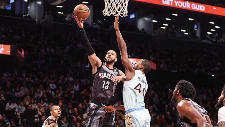 Dec 27, 2024; Brooklyn, New York, USA; Brooklyn Nets guard Tyrese Martin (13) drives past San Antonio Spurs forward Harrison Barnes (40) in the third quarter at Barclays Center. Mandatory Credit: Wendell Cruz-Imagn Images Dec 27, 2024; Brooklyn, New York, USA; Brooklyn Nets guard Tyrese Martin (13) drives past San Antonio Spurs forward Harrison Barnes (40) in the third quarter at Barclays Center. Mandatory Credit: Wendell Cruz-Imagn Images