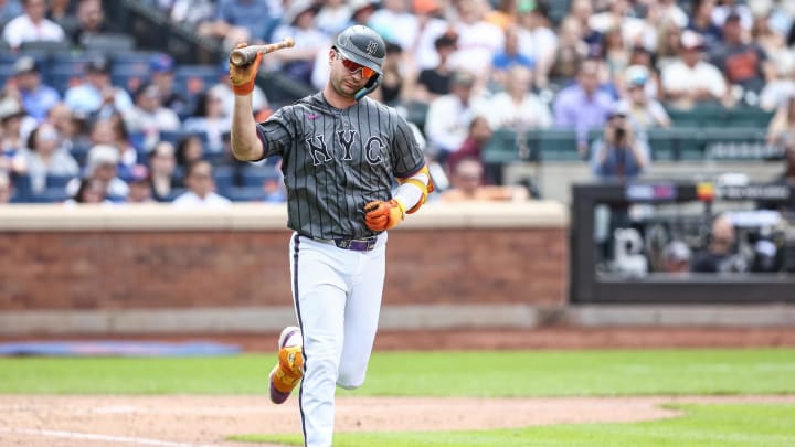 May 25, 2024; New York City, New York, USA;  New York Mets first baseman Pete Alonso (20) throws his bat after flying out to end the seventh inning against the San Francisco Giants at Citi Field. Mandatory Credit: Wendell Cruz-USA TODAY Sports