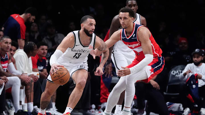 Oct 14, 2024; Brooklyn, New York, USA; Brooklyn Nets small guard Shake Milton (13) dribbles the ball against Washington Wizards forward Patrick Baldwin Jr. (7) during the second half at Barclays Center. Mandatory Credit: Gregory Fisher-Imagn Images Oct 14, 2024; Brooklyn, New York, USA; Brooklyn Nets small guard Shake Milton (13) dribbles the ball against Washington Wizards forward Patrick Baldwin Jr. (7) during the second half at Barclays Center. Mandatory Credit: Gregory Fisher-Imagn Images