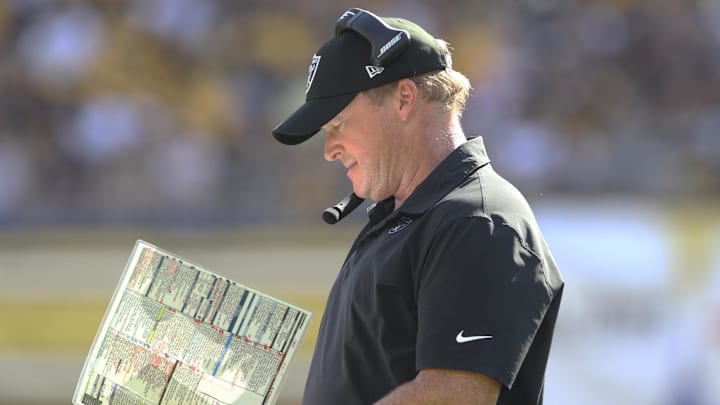 Sep 19, 2021; Pittsburgh, Pennsylvania, USA;  Las Vegas Raiders head coach Jon Gruden looks at his play chart against the Pittsburgh Steelers during the fourth quarter at Heinz Field. Las Vegas won 26-17.  Mandatory Credit: Charles LeClaire-Imagn Images